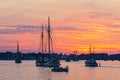 Sailing ships on the river Warnow in the sunset during the Hanse Sail in Rostock, Germany Royalty Free Stock Photo