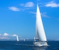 Sailing ships yachts with white sails in the open sea Royalty Free Stock Photo