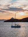 Sailing at sunset, Mediterranean sea. Lighthouse at Kea island, Greece Royalty Free Stock Photo