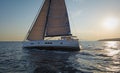 Sailing at the sunset. Modern sailing yacht. Royalty Free Stock Photo