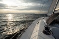 Sailing into the sunset on a sailing yacht Royalty Free Stock Photo