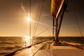 Sailing towards sunset at open sea Royalty Free Stock Photo