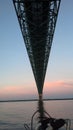 Sailing under the Mackinac Bridge at Daybreak Royalty Free Stock Photo