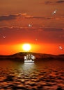 Sailing vessel against the coming sun Royalty Free Stock Photo