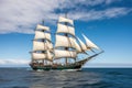 sailing vessel in full sail, with billowing sails and tranquil waters Royalty Free Stock Photo