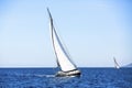 Sailing in the wind through the waves at the Aegean Sea in Greece. Royalty Free Stock Photo