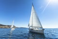 Sailing in the wind through the waves at the Aegean Sea in Greece. Royalty Free Stock Photo