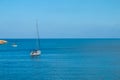 Sailing yacht in the blue sea. Ship yacht sails in the open Sea. Luxury boats. Crete, Greece. Royalty Free Stock Photo