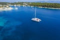 Sailing yacht boat in blue sea arrive Fiscardo village in Kefalonia island, Greece Royalty Free Stock Photo