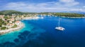 Sailing yacht boat in blue sea arrive Fiscardo village in Kefalonia island, Greece Royalty Free Stock Photo