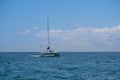 Sailing yacht catamaran sails on the waves in the warm Caribbean Sea. Sailboat. Sailing. Cancun Mexico. Summer sunny day Royalty Free Stock Photo