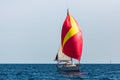 Sailing yacht with colorful bright gennaker in the regatta at Aegean sea. Royalty Free Stock Photo