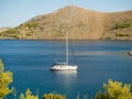 Sailing yacht in Croatia, anchoring in a bay, windy summer on th