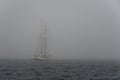 Sailing yacht in deep fog over sea Royalty Free Stock Photo