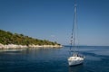 Sailing yacht at sea near small island