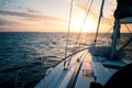 Sailing yacht at sunset in the open sea Royalty Free Stock Photo