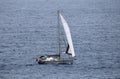 Sailing yacht with white sail on open water Royalty Free Stock Photo