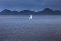 Sailing yacht with white sails in the open sea Royalty Free Stock Photo