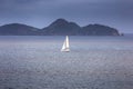 Sailing yacht with white sails in the open sea Royalty Free Stock Photo