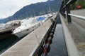 Sailing yachts and motor boats in a marina covered for winter season are moored in marina. Royalty Free Stock Photo