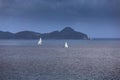 Sailing yachts with white sails in the open sea Royalty Free Stock Photo