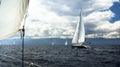 Sailing yachts with white sails in stormy weather. Royalty Free Stock Photo