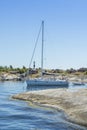 Sailingboat navigating narrow passage HuvudskÃÂ¤r Stockholm archipelago Royalty Free Stock Photo