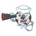 Sailor with binocular soccer ball in a cartoon basket