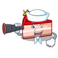 Sailor with binocular strawberry cake mascot cartoon