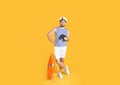 Sailor with binoculars and ring buoy on yellow background Royalty Free Stock Photo