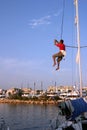 Sailor climbing mast