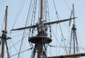 Sailor climbing the rigging of old replica sailing ship Royalty Free Stock Photo