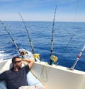 Sailor man fishing resting in boat summer vacation