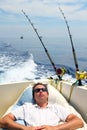 Sailor man fishing resting in boat summer vacation Royalty Free Stock Photo