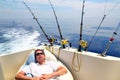 Sailor man fishing resting in boat summer vacation Royalty Free Stock Photo