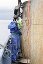 sailor paint old rusty pipe on top a funnel