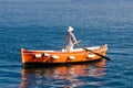 Sailor rowing on wooden taxi boat Royalty Free Stock Photo