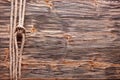 Sailor's knot over old wooden desk.