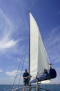 Sailor in sailboat rigging the sails Royalty Free Stock Photo