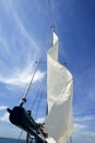 Sailor in sailboat rigging the sails Royalty Free Stock Photo