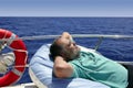 Sailor senior man having a rest on summer boat