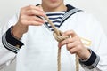 Sailor tying a sea knot Royalty Free Stock Photo