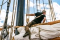 Rostock, Germany - August 2016: Sailor working on sailing ship.