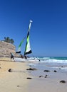 Sailors pulling their sailboat ashore. Playa de Butihondo, Morro Jable, Fuerteventura