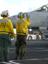 Sailors at work on flight deck Royalty Free Stock Photo