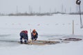 Sailors work at the lane with a fenced wooden formwork Royalty Free Stock Photo