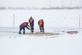 Sailors work at the lane with a fenced wooden formwork Royalty Free Stock Photo