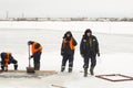 Sailors work at the lane with a fenced wooden formwork Royalty Free Stock Photo