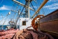 Sailship deck with helm, rigging and cables. Royalty Free Stock Photo