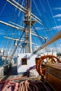 Sailship deck with helm, rigging and cables. Royalty Free Stock Photo